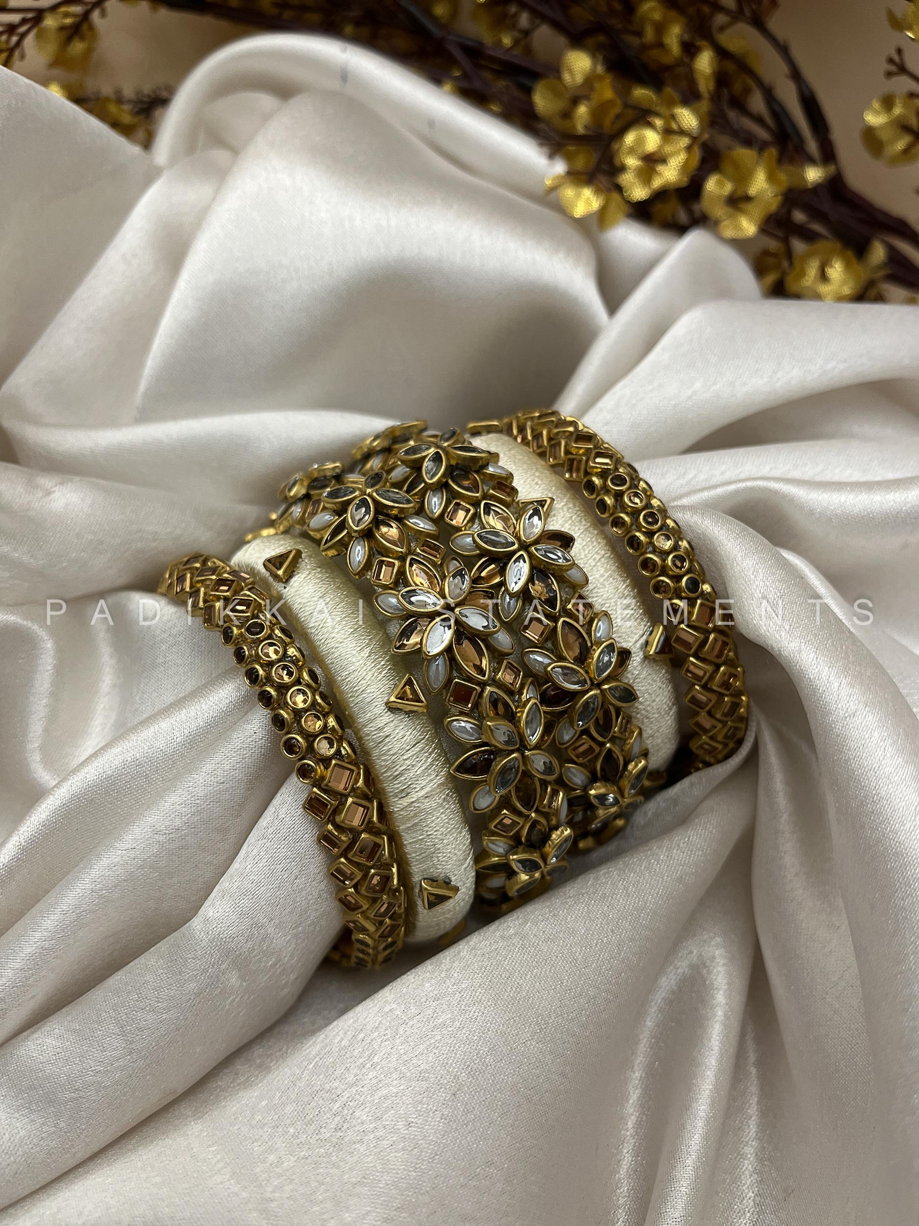 Divya Pushpa Aura Kundan Set - Ivory and Gold Divya Pushpa Aura Kundan Set - Ivory and Gold